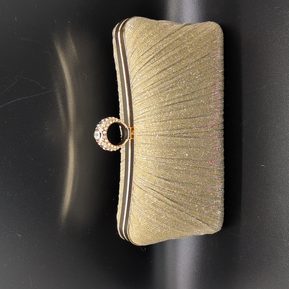 Women's gold glitter clutch bag.